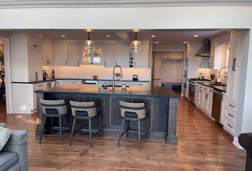 Open-concept kitchen remodel by Tamer Construction with a custom island and hardwood floors